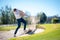 Golfer playing a chip shot onto the green