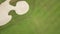 Golfer playing in golf on green course top view from flying drone. Aerial view people playing on green field in golf