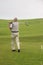 A golfer plays golf on the golf course of St Bees, England.