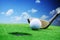 Golfer prepared for a golf shut in green grass in a sunny day with clear blue sky