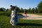 Golfer prepares to hit the golf ball from the sand trap