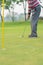 Golfer preparing for a putt Golf ball on the green during golfcourse