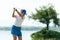 Golfer sport course golf ball fairway. People lifestyle woman playing game golf tee of on the green grass