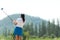 Golfer sport course golf ball fairway. People lifestyle woman playing game golf tee of mountain background.