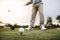 Golfer taking a shot at golf course driving range