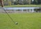 Golfer Teeing off in front of a Water trap