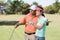 Golfer woman pointing while standing by man