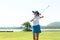 Golfer women sport course golf ball fairway. People lifestyle woman playing game golf tee of on the green grass sunset background