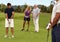 Golfers playing on the green