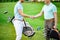 Golfers shake hands with each other