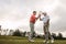 Golfers shaking hands at golf course after the game