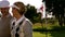 Golfing couple smiling at the eighteenth hole on the golf course