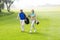 Golfing couple walking on the putting green