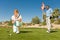 Golfing couple watching ball rolling