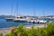 Golfo Aranci, Sardinia, Italy - Panoramic view of Golfo Aranci yacht port - Marina di Golfo Aranci - with seashore park boulevard