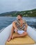 Golfo di Orosei Sardina, Men on the beach chilling in speed boat Sardinia Italy, young guy on vacation Sardinia Italy