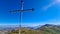 Goli Vrh - Summit cross of mountain Goli Vrh. Panoramic aerial view on dramatic karst mountain chains Dinaric Alps, Montenegro