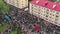 Gomel, Belarus - 05/09/2019: Crowd of people on a city street, top view, vertical flight over roofs of bright houses