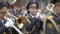 Gomel, Belarus - 05/09/2019: Male military musicians play wind instruments during festive parade