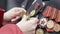 Gomel, Belarus - 09/05/2019: Female hands fasten a memorial sign on the chest of a war veteran, many medals and orders on chest