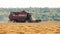 Gomel, Belarus - July 30, 2020: Combine Harvester PALESSE GS 12 Working In Field. Harvesting Of Wheat In Summer Season