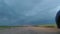 GOMEL, BELARUS - May 15, 2018: blue car parked in the field against a stormy sky.