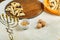Gomentashi cookies for Purim holiday on a table on a wooden board next to the menorah.