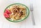 Gomiti Pasta with fried chicken and onion pieces with tomato and