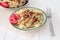 Gomiti Pasta with fried chicken and onion pieces with tomato and