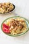 Gomiti Pasta with fried chicken and onion pieces with tomato and