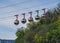 Gondola bubbles against the blue sky. Cable car taking tourists to Fort de La Bastille in Grenoble, France