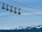 Gondola bubbles with French Alps in the background. Cable car taking tourists to Fort de La Bastille in Grenoble, France.