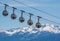 Gondola bubbles with French Alps in the background. Cable car taking tourists to Fort de La Bastille in Grenoble, France.