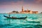 Gondola on Canal Grande with San Giorgio Maggiore church at sunset, Venice, Italy