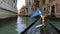 Gondola floating down narrow canal