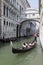 The gondola going across the bridge of sighs in venice,italy