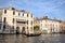 Gondola on golden waters of Grand Canal in Venice