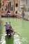 Gondola with gondolier on a canal in Venice, Italy