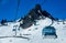 Gondola lift going up at the Snowbasin Ski Resort.