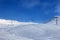 Gondola lift and off-piste ski slope in fog