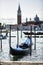 Gondola moored by Saint Mark square with San Giorgio di Maggiore church in Venice, Italy