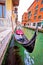 Gondola in narrow Venice channel view