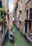 Gondola sailing tourists in Venice