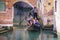 Gondola sails down the channel in Venice