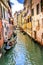 Gondola Tourists Colorful Small Side Canal Bridge Venice Italy