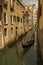 Gondola travels in a side canal, Venice, Italy