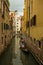 Gondola travels in a side canal, Venice, Italy