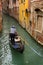 A gondola in Venice with a group of tourists