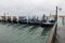 Gondolas boats in Venice without people and the Church of Saint