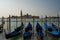 Gondolas docked on the venetian lagoon